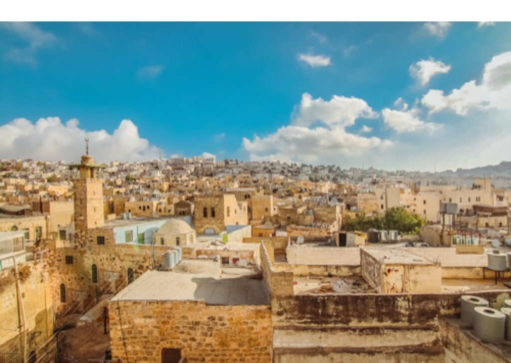 The city of Hebron in the West Bank on a sunny day during the occupation.